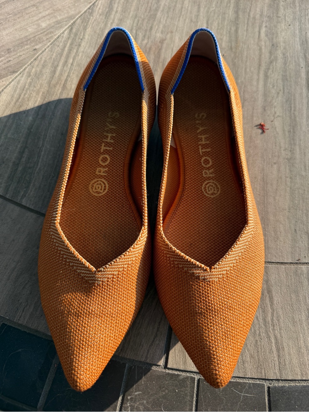 Rothy's Pointed Knit Flats in Burnt Orange with Blue Trim